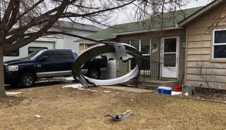 Flight drops debris on neighborhood during emergency landing