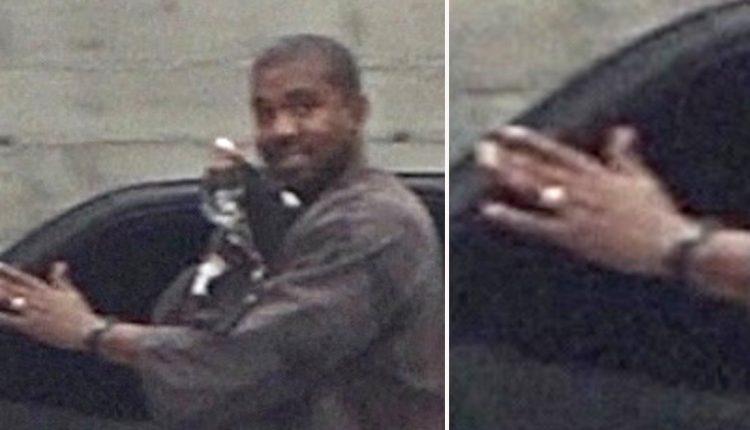 Kanye West all smiles as he’s pictured wearing wedding ring after Kim Kardashian filed for divorce