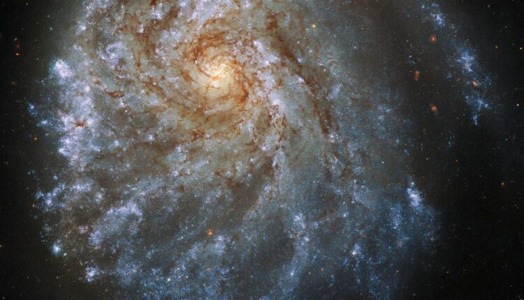 The Hubble Space Telescope takes a closer look at an unusual spiral galaxy 120 million light-years away