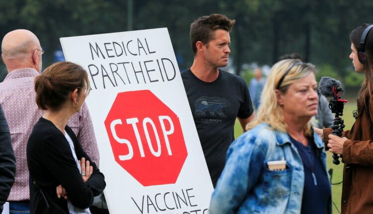 Dutch marchers protest new COVID-19 pass to enter bars, restaurants
